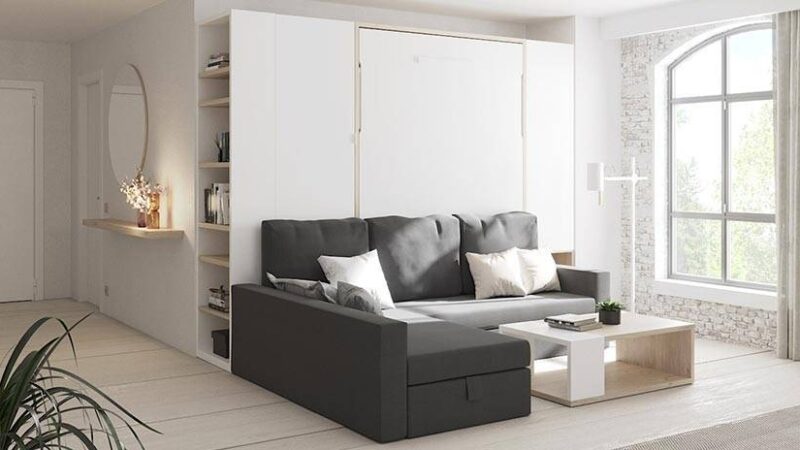 Cama abatible de matrimonio con sofá chaise longue y arcón de gran capacidad.