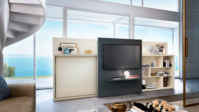 Mueble cama abatible individual con estantería lateral y panel deslizante para TV.